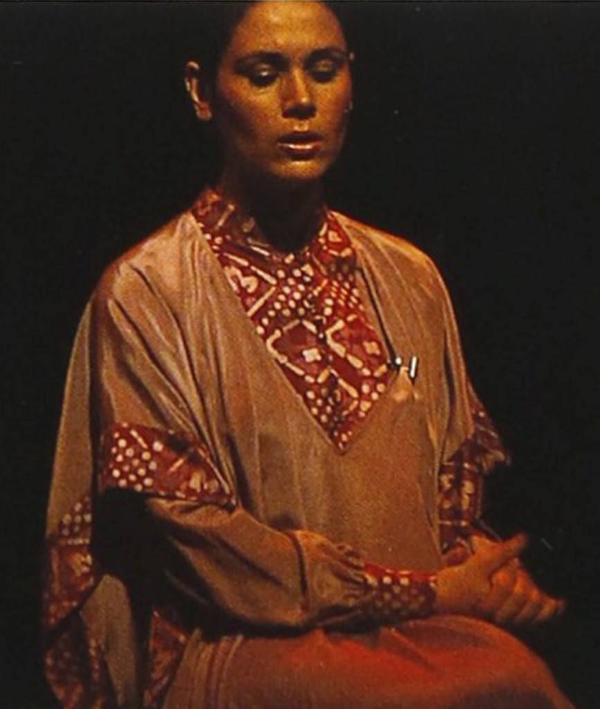 Parissa seated in traditional tan robe, hands clasped — Asian Traditional Performing Arts Festival, Japan, 1978