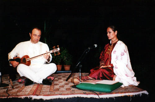 Parissa and Daryush Tala'i performing Persian classical music on stage at the Honolulu Academy of Arts — Parissa at microphone, Tala'i on tar, 2002