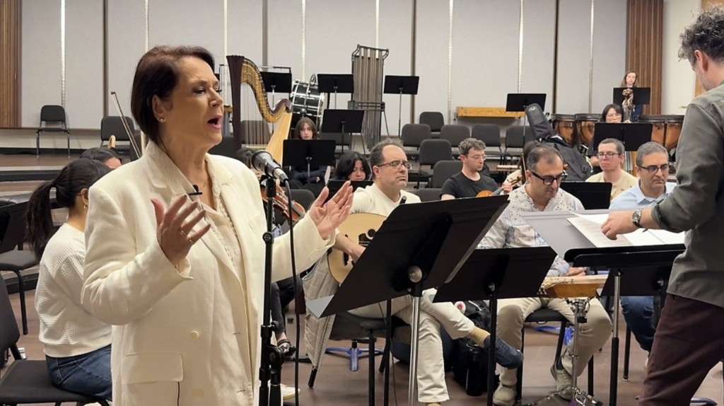 Parissa singing at rehearsal with the Iranshahr Orchestra — Spectrum News 1 Los Angeles coverage of Light Always Prevails, March 2026